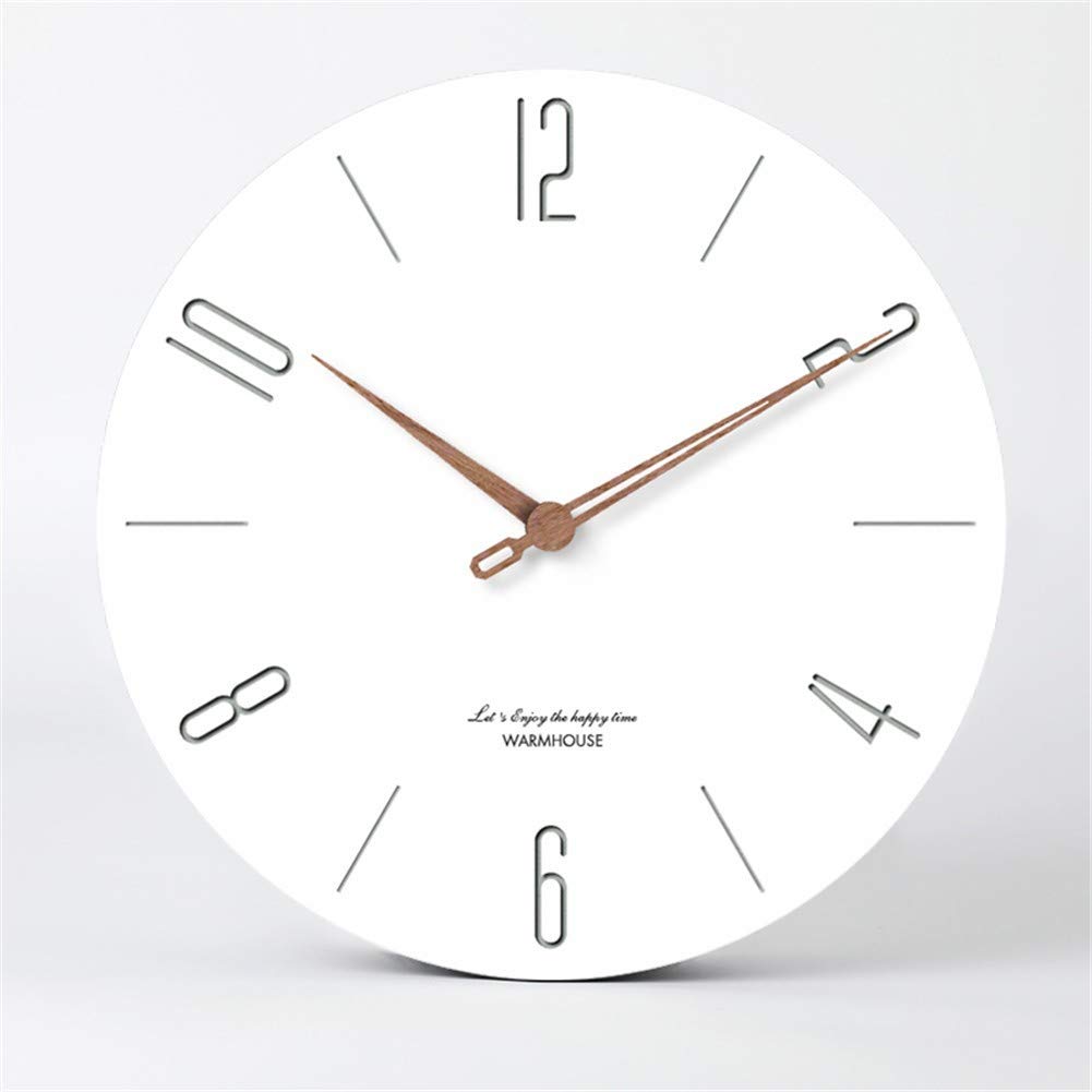 Horloge minimaliste ronde sans cadre pour habiller un mur blanc de salon