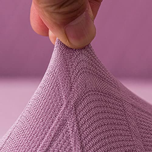 Housse de canapé extensible rose pour protéger le fauteuil du salon