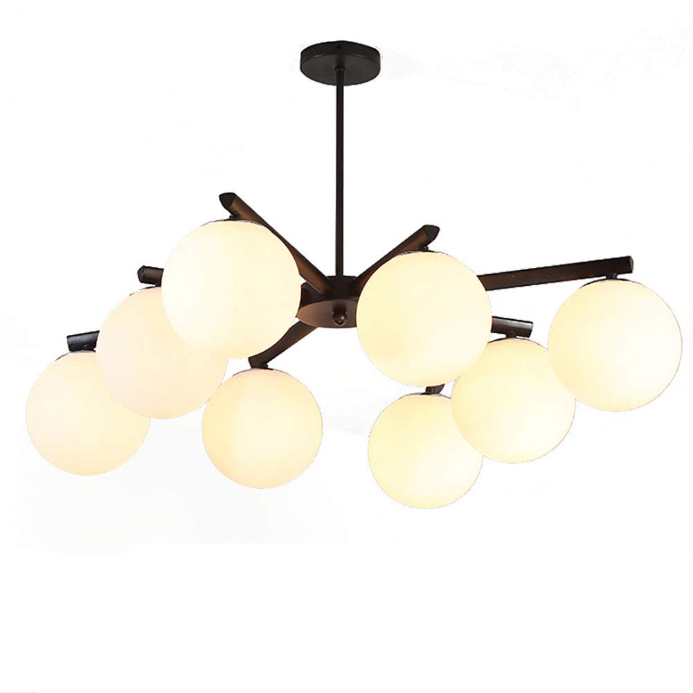 Lampe suspendue vintage noire pour éclairer chaleureusement une table de ferme familiale