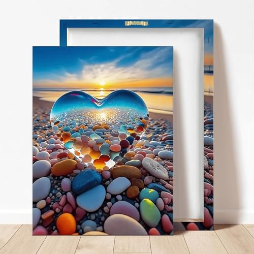 Coucher de soleil sur la plage en tableau cœur de galets pour salon