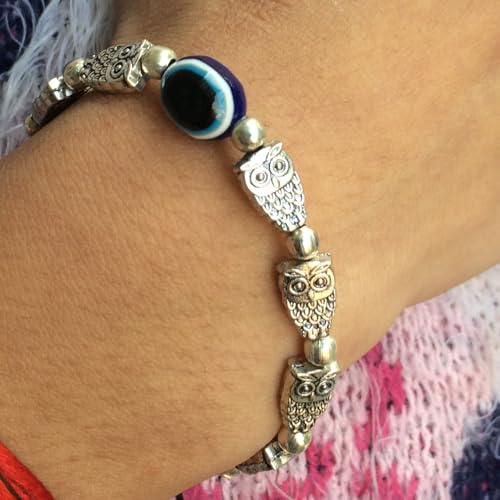 Image of Touchstone New Indian Bollywood Handcrafted Blue Evil Eye Engraved Owl Motif Metallic Beads Fabulous Style Designer Jewelry Adjustable Thread Bracelet in Oxidized Silver Tone for Women