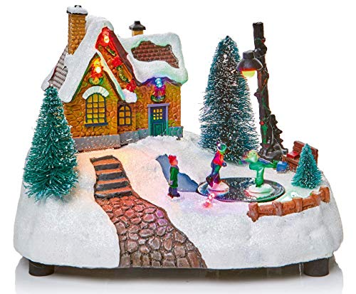 Escena de nieve de aldea tradicional animada navideña con luces LED multicolor con patines giratorios y lámpara