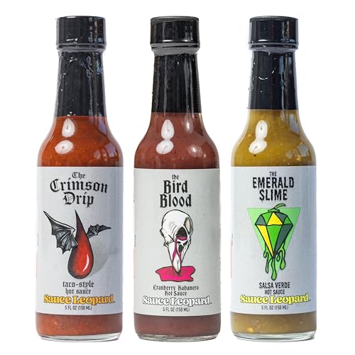 three small hot sauce bottles in a box, labeled mild and medium heat