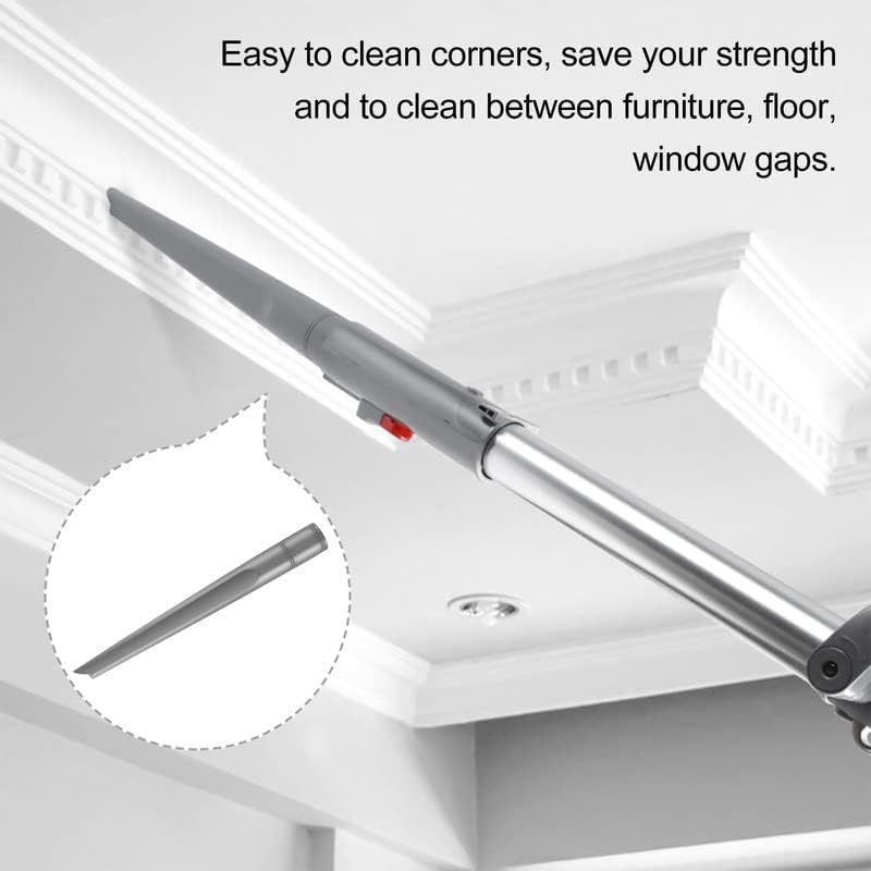 Crevice tool being used to clean a ceiling molding