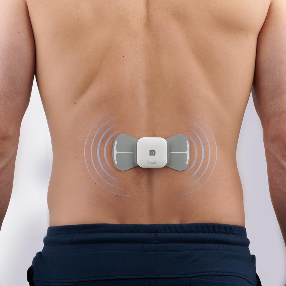 The Hammacher Schlemmer TENS unit applied to a person's lower back, with blue wave patterns indicating the TENS stimulation area.