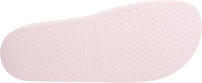 The footbed of the Adilette Aqua Slides is cushioned for added comfort, making them perfect for casual wear or after workouts. The outsole is made of synthetic material for durability and traction, so you can wear them on a variety of surfaces. These slides are unisex and come in a range of sizes to fit both men and women.