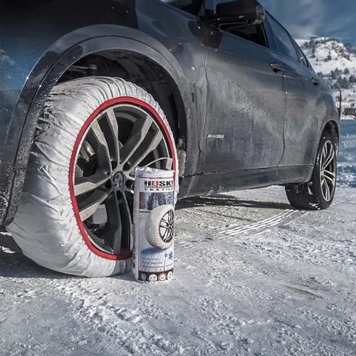 Cadena de nieve Husky instalada en la rueda de un SUV negro en un entorno nevado