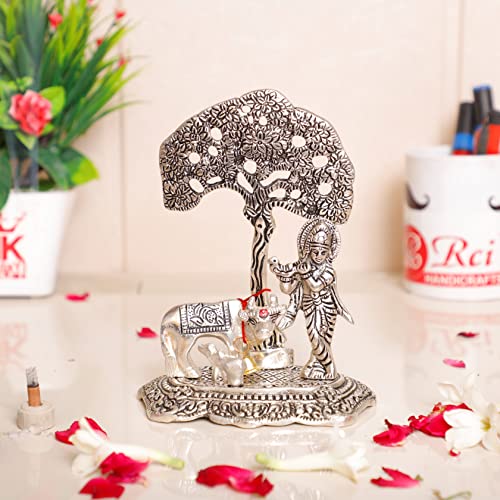 KridayKraft सिल्वर प्लेटेड कामधेनु गाय कृष्ण स्टैंडिंग के साथ ट्री प्लाइंग बांसुरी मेटल स्टैच्यू, कृष्ण मूर्ति मूर्ति मूर्ति पूजा और सजावट के लिए आपका