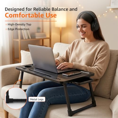 Image of Amazon Basics Engineered Wood Foldable Laptop Table with Cup and Pen Holder, Tablet and Mobile Phone Groove | Mini Drawer, Use for Writing, Bed, Breakfast (60L x 40W x 25H cm, Black)