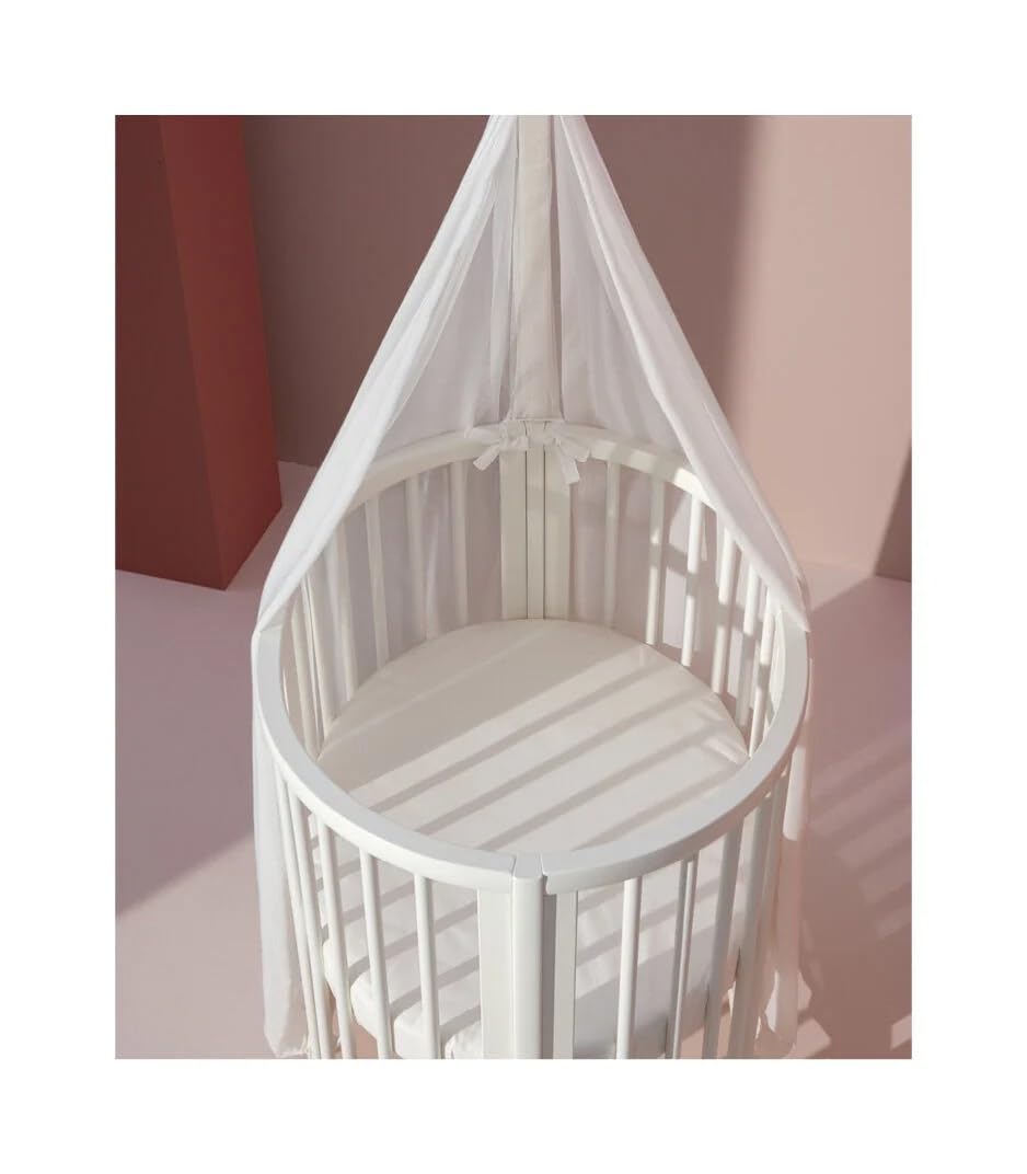Stokke Sleepi Mini, Bianco - Culla ovale adatta per 0-6 mesi - Base regolabile in altezza, ruote girevoli bloccabili, base materasso traforata per la circolazione dell'aria