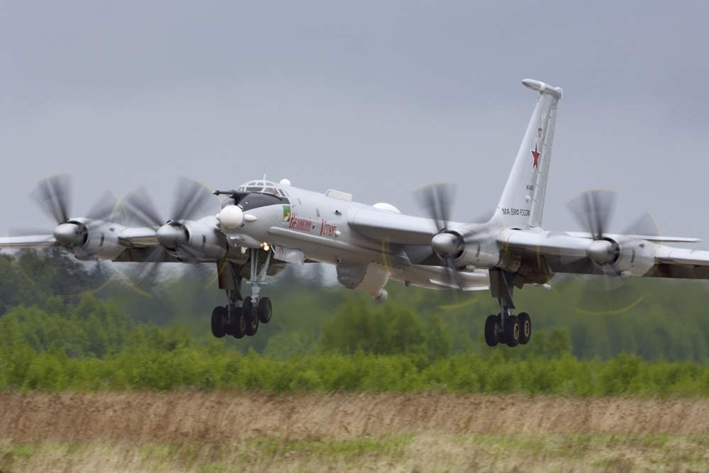 Tu-142MR reconnaissance aircraft of the Russian Navy landing. Poster Print by Artem Alexandrovich/Stocktrek Images (17 x 11)
