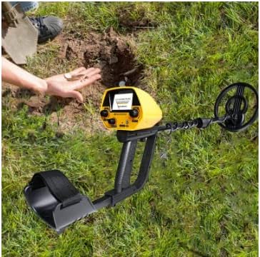 Person using VIHELM MD5090 Metal Detector in a field