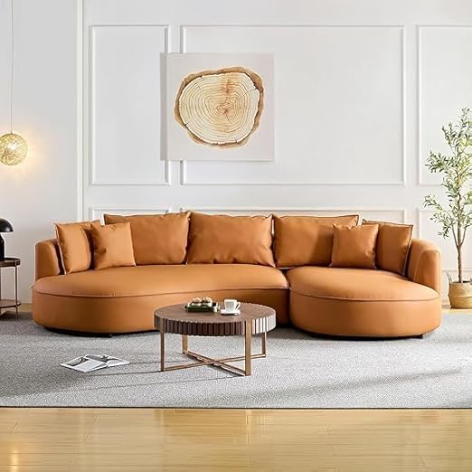Image of Modern Curved White Sofa Couch with Plush Pillows - 4 Seater Upholstered Living Room Sofa | Contemporary Minimalist Design for Home, Office & Lounge. (Orange RHS.)