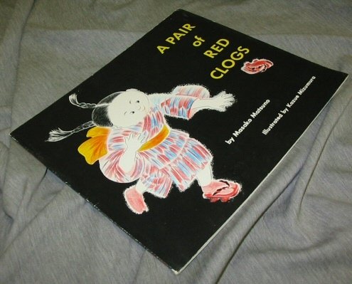 Pair of Red Clogs 0399207961 Book Cover