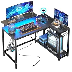 Bestier Gaming Desk with Power Outlets, 42″ L-Shaped Gaming Desk with LED Lights, Desk with Reversible Storage Shelves & Hooks for Small Spaces, Bedrooms & Offices, Black Carbon Fiber