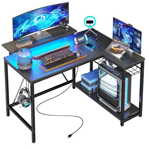 Bestier Gaming Desk with Power Outlets, 42″ L-Shaped Gaming Desk with LED Lights, Desk with Reversible Storage Shelves & Hooks for Small Spaces, Bedrooms & Offices, Black Carbon Fiber