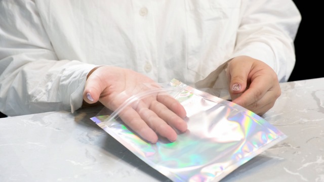 COSMOSTARART 50 Pack Holographic Smell-Proof Bags, 6x9 Inches, Clear Front Mylar Ziplock Pouches – Great For Snacks, Jewelry, Crafts & More - View #2