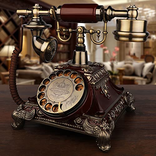 Téléphone rotatif rétro rouge et téléphone fixe filaire antique