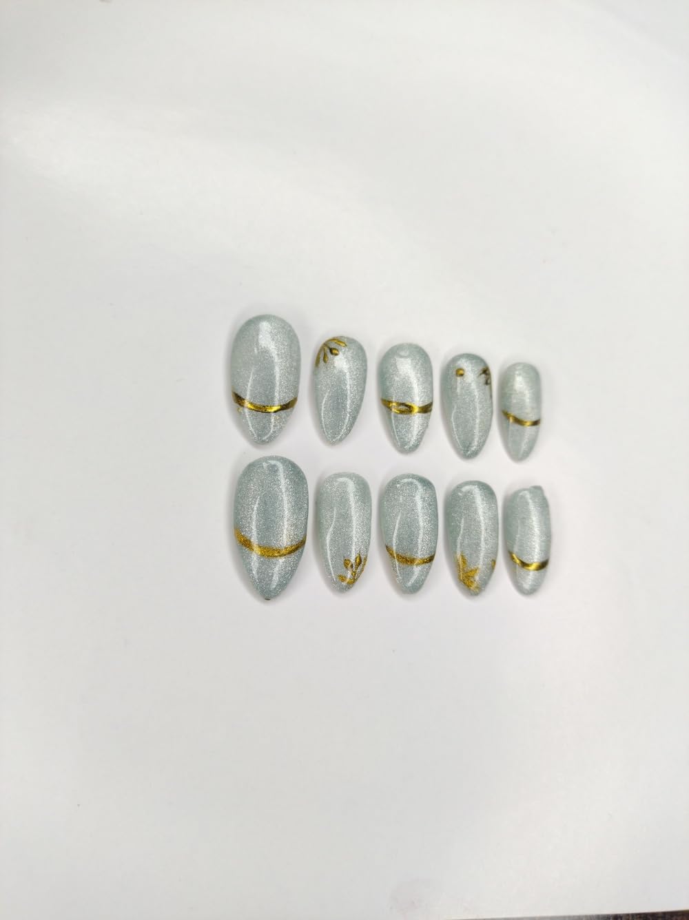 Handmade Sky Blue Cat Eye Press On Nails with Gold Art, Oval Shape, Glossy Finish, 12 Pieces-image-41