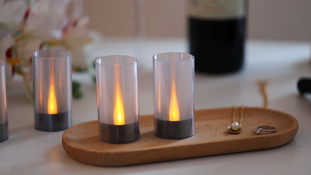 Image of Lanker Flameless Candles, Battery Operated LED Pillar D1.5 x H3 inch, Flickering Warm Yellow Long Flame-Effect Light with Black Base, Romantic Electronic Fake Set of 12 (Black)
