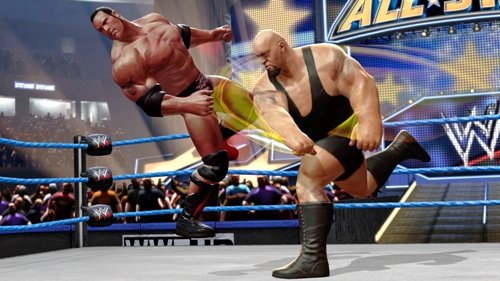 John Cena performing a diving attack on a downed opponent