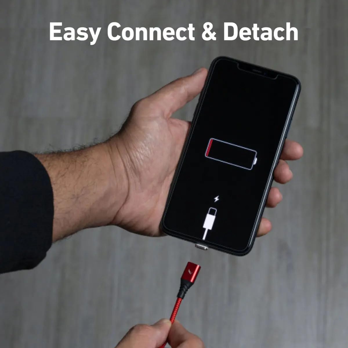 A hand connecting the magnetic cable to a smartphone with a low battery indicator, showing the 'Easy Connect & Detach' feature.