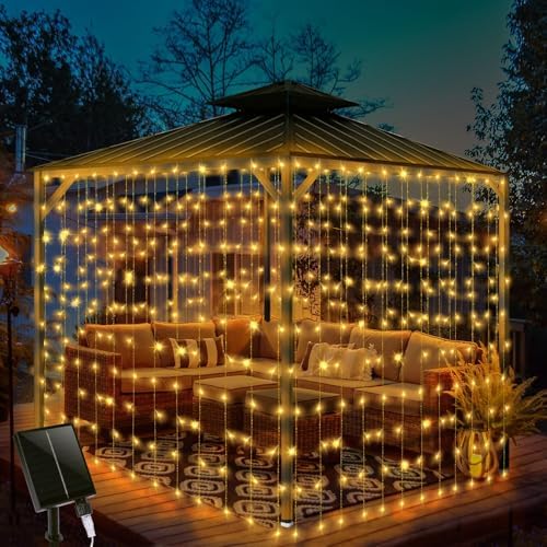 5 Outdoor Solar Curtain Lights That Will Transform Your Space 3 32.8 * 6.56FT Large Size Solar Curtain Lights Outdoor, 8 Modes Outdoor Solar Curtain String Light, Solar Garden Christmas Lights Decortions for Patio, Gazebo, Eaves, Fence, Tree, Porch (Warm White)