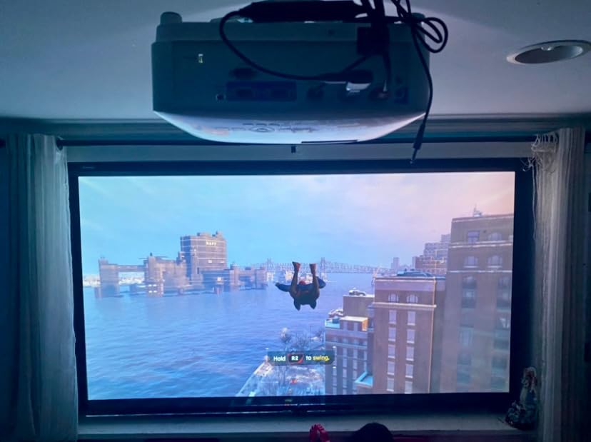 BenQ projector review hero image showing a BenQ home entertainment projector