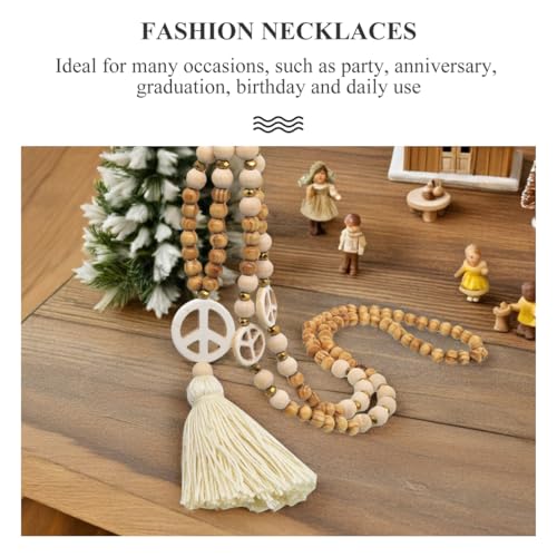 DEARMAMY Halskette Mit Quaste Und Holzperlen Friedenszeichen Anhänger Für Damen Boho Stil Ideal Layering Kette Perfekte Geschenkidee Für Frauen Zarte üßwasserperlen Und Charmante