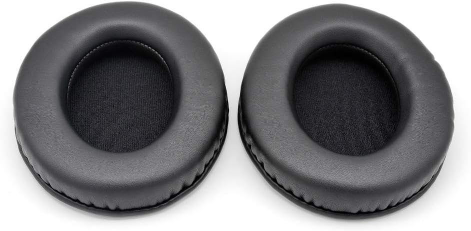 Top-down view of two black replacement earpads, showing the smooth outer surface and the inner mesh fabric.