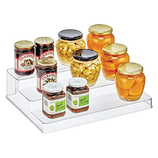 mDesign Plastic Kitchen Spice Bottle Rack Holder, Food Storage Organizer for Cabinet, Cupboard, Pantry, Shelf - Holds Spices, Mason Jars, Baking Supplies, Canned Food - 3 Level Storage - Clear