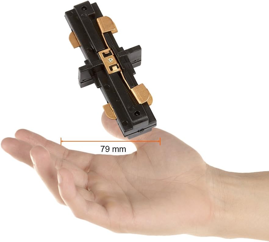 Hand holding Tecnolite YS-I/N straight connector, illustrating its compact size (79mm).
