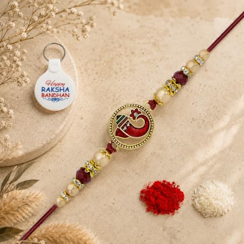 Image of Riddhika Ventures Religious Gold Plated Meenakari Sacred Ganesha Rakhi with Roli Chawal, Greeting Card & Happy Raksha Bandhan Keychain