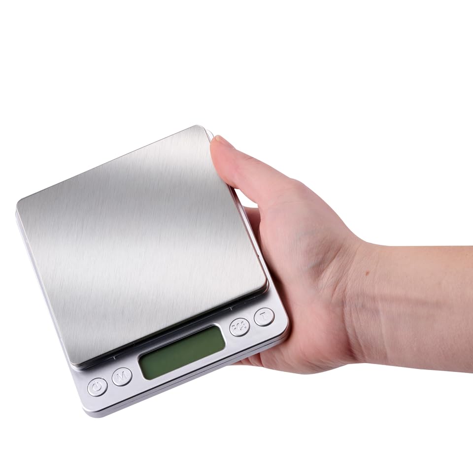 alpina Digital Precision Scale held in a hand, showing its compact size