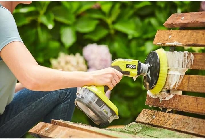 Man cleaning a caravan/RV with the RYOBI ONE+ Cordless Compact Power Scrubber