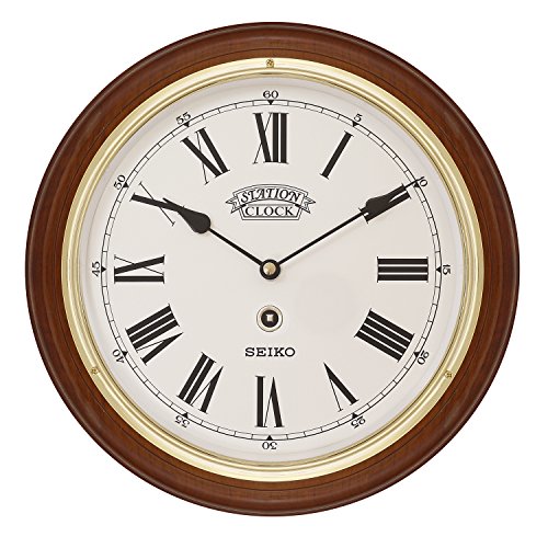 Seiko Dark Wooden Quartz/Battery Round Station Wall Clock with Gold Coloured Bezel, White Dial & Roman Numerals. QXA143B