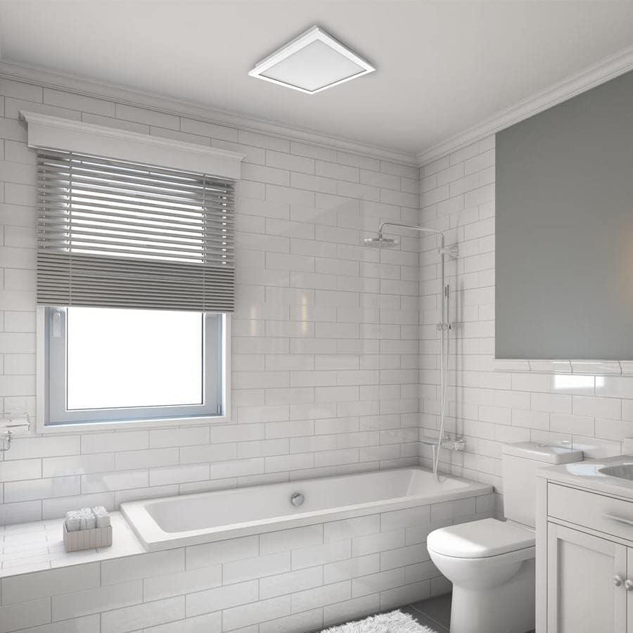 Utilitech Bathroom Fan installed in a modern white tiled bathroom ceiling