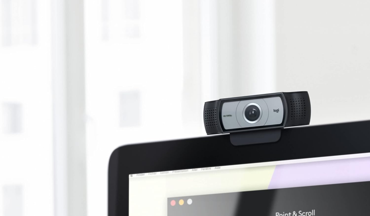 లాజిటెక్ C930e Webcam securely mounted on top of a computer monitor.