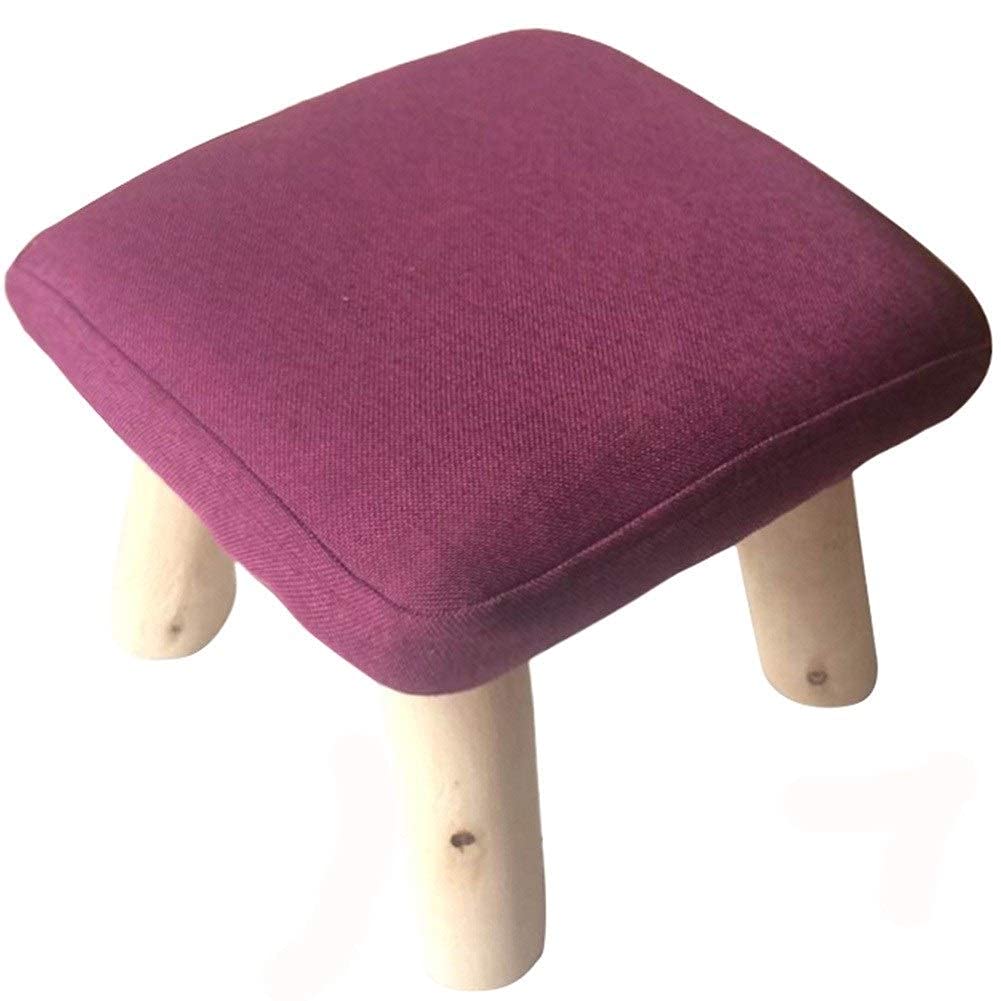 Repose-pieds en bois et tissu pour un coin lecture cosy violet