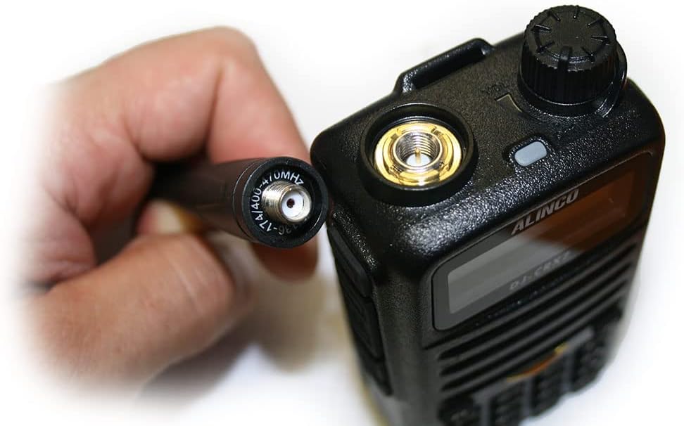 PNI Alinco DJ-CRX-7 Portable Radio components including radio body, antenna, battery, desktop charger, wall adapter, belt clip, and wrist strap.