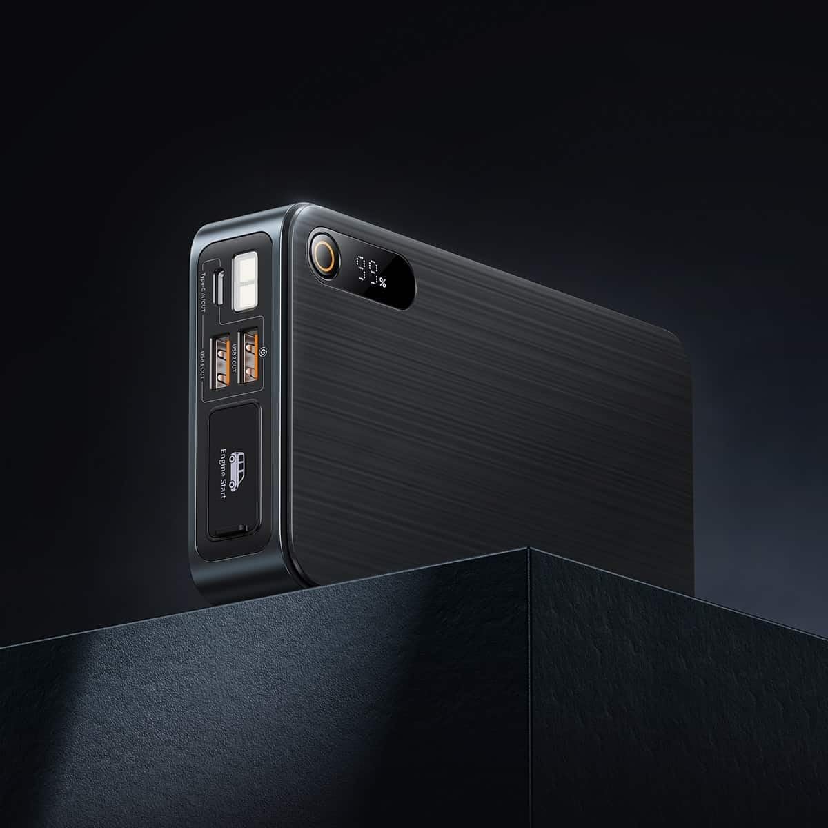 Primeiro plano view of the Baseus Super Energy Pro Car Jump Starter's ports and display, showing USB-A output, Type-C input/output, Engine Start port, and LED light.