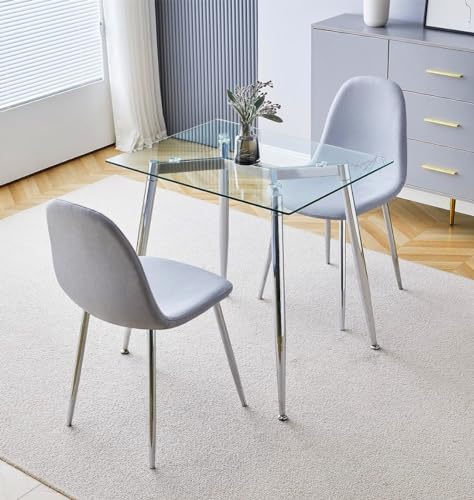 Mesa de comedor rectangular de cristal templado con sillas de tela y patas cromadas 2