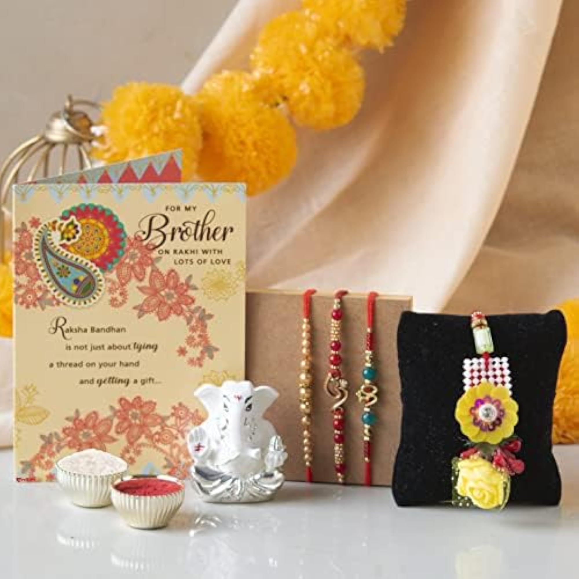 Ganesha Idol Combo Set with 3 Special Rakhi for Brother