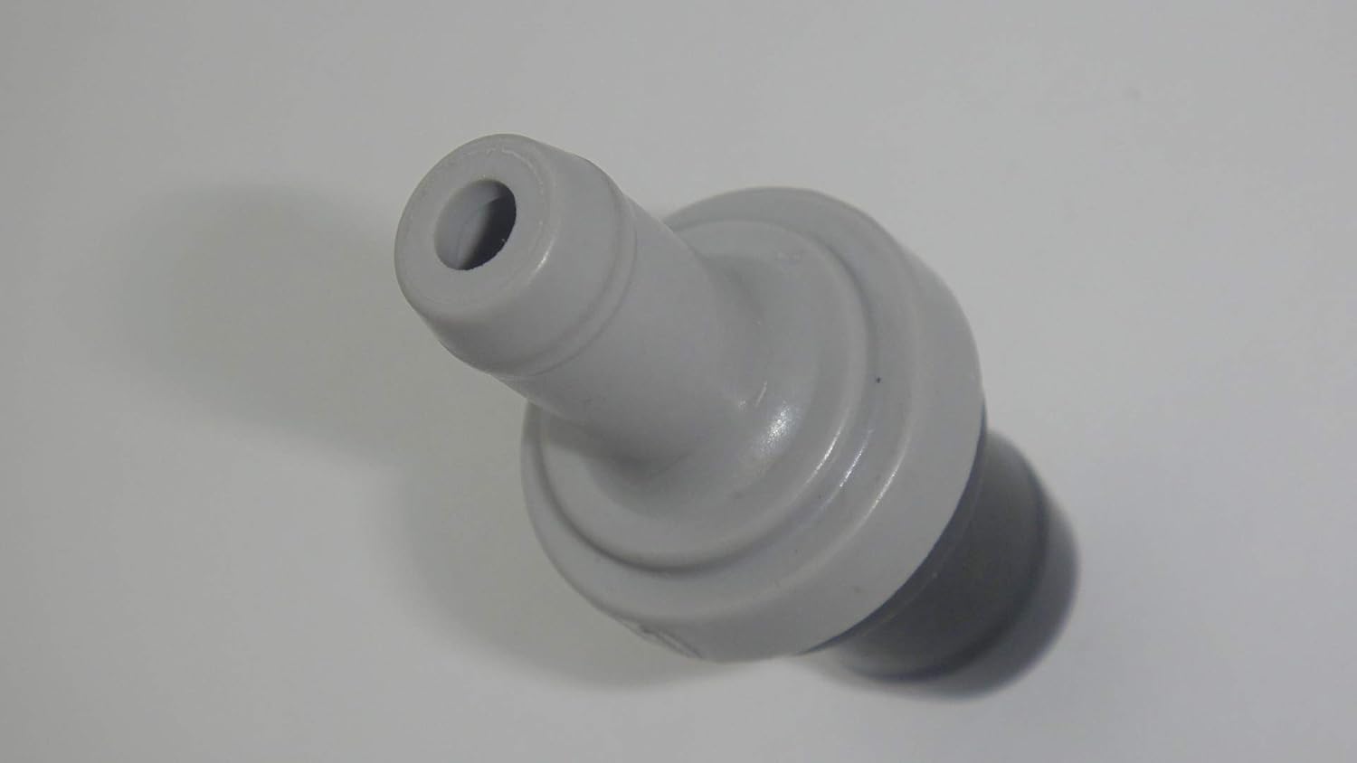 Angolat view of the PCV Valve 18118-78G50 from one end, showing the internal mechanism.