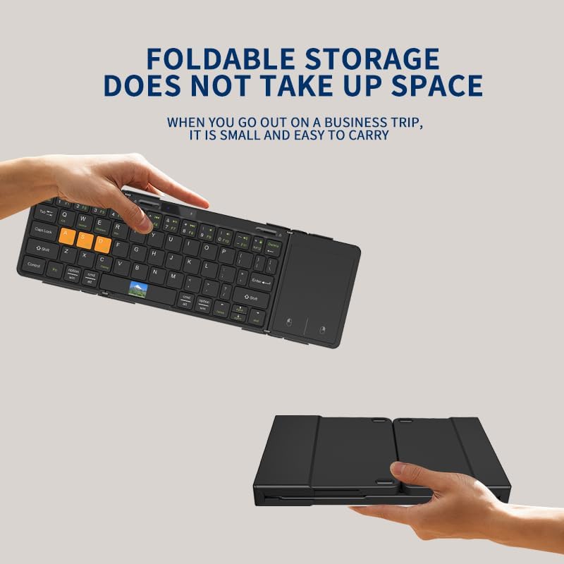 Hands holding the folded keyboard, demonstrating its compact size for storage