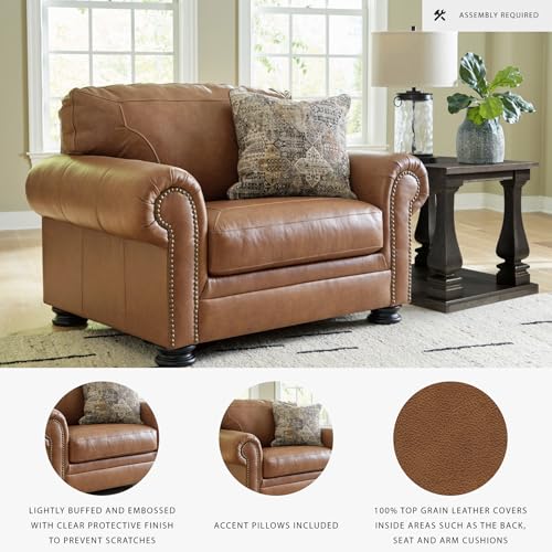 Image of Signature Design by Ashley Carianna Oversized Leather Accent Chair, Caramel | Top-grain leather seating, Durable faux leather outer panels, Extra-wide 54 in frame, Traditional living room style