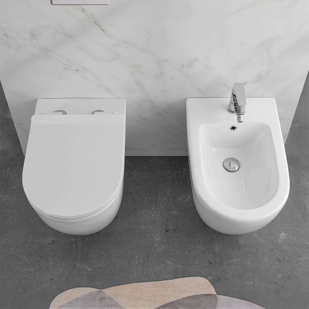 Wc e bidet rialzati filomuro per anziani e disabili, in ceramica scarico traslato 6-23 cm e sedile soft-close, serie COMODA