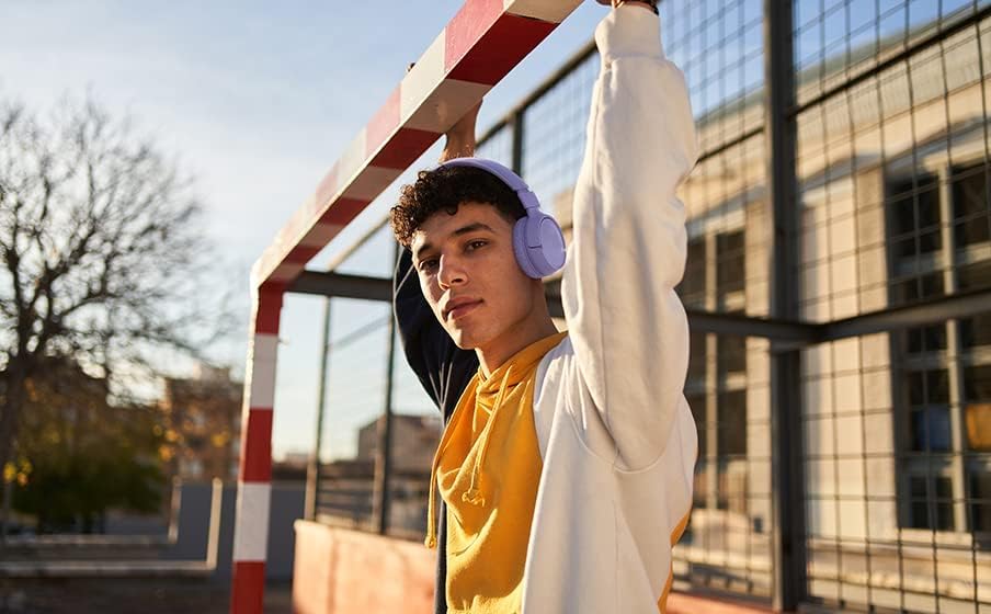 Person wearing JBL Tune 520 BT headphones