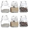 Floriya glass storage jars with various spices and herbs, showcasing transparency