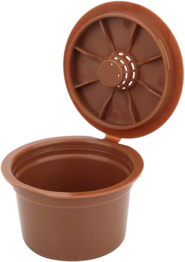 An empty Fdit refillable coffee capsule with its lid open, showing the clean interior.